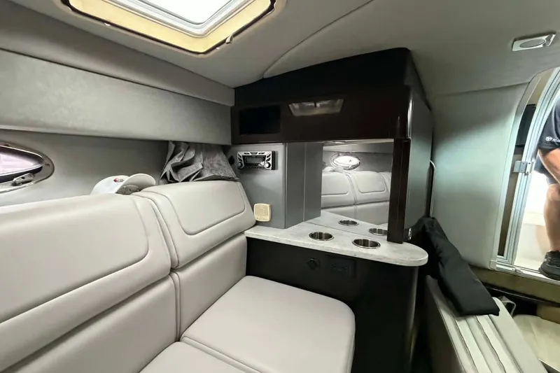 Slide: The Image of Interior of a 2018 Formula 310 Sun Sport boat, featuring plush seating and modern amenities. - 18