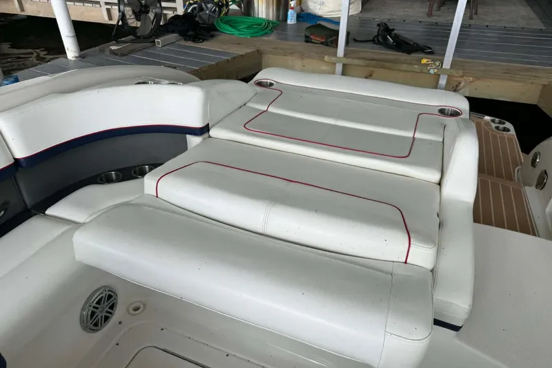 Slide: The Image of 2018 Formula 310 Sun Sport boat interior with white seating and red accents. - 20