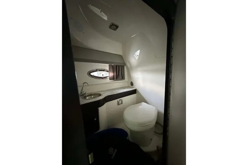 Slide: The Image of Interior of 2018 Formula 310 Sun Sport boat bathroom with sink and toilet. - 23