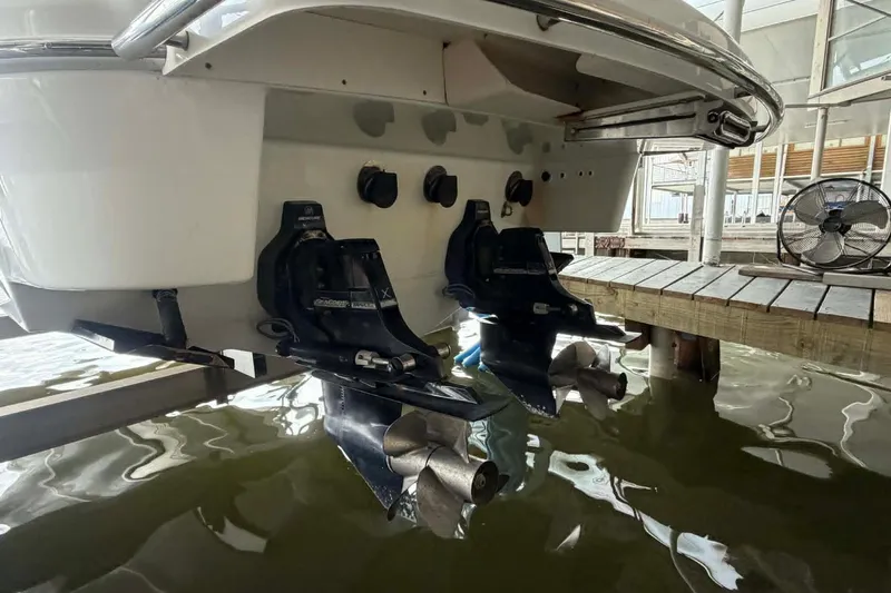 Slide: The Image of 2018 Formula 310 Sun Sport boat stern with dual propellers in docked position. - 3