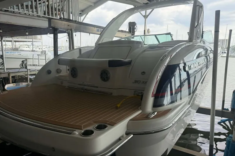Slide: The Image of 2018 Formula 310 Sun Sport boat docked in marina, rear view. - 4
