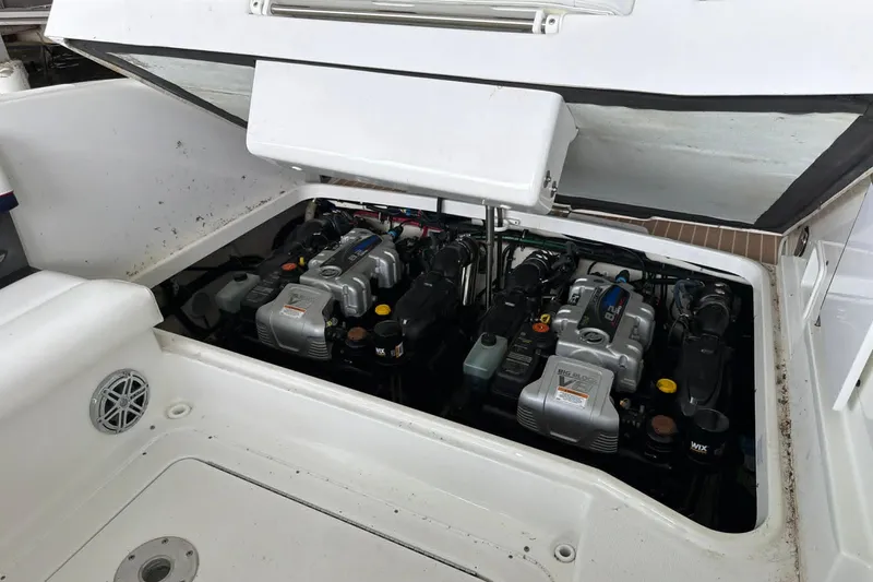 Slide: The Image of Engine compartment of a 2018 Formula 310 Sun Sport boat, showcasing dual engines. - 8