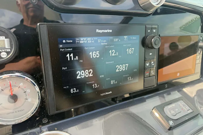 Slide: The Image of Dashboard of a 2018 Formula 310 Sun Sport with Raymarine display and gauges. - 9