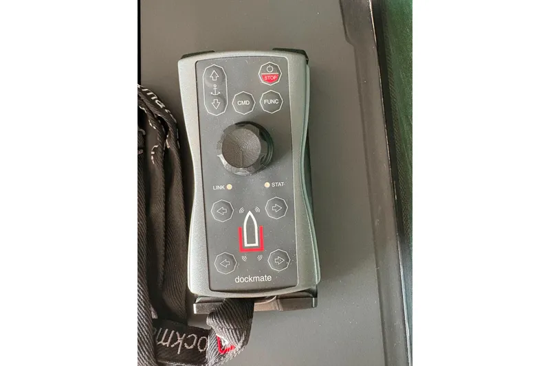 Slide: The Image of Remote control for 2024 Axopar 37 XC Cross Cabin boat, featuring various navigation buttons. - 12
