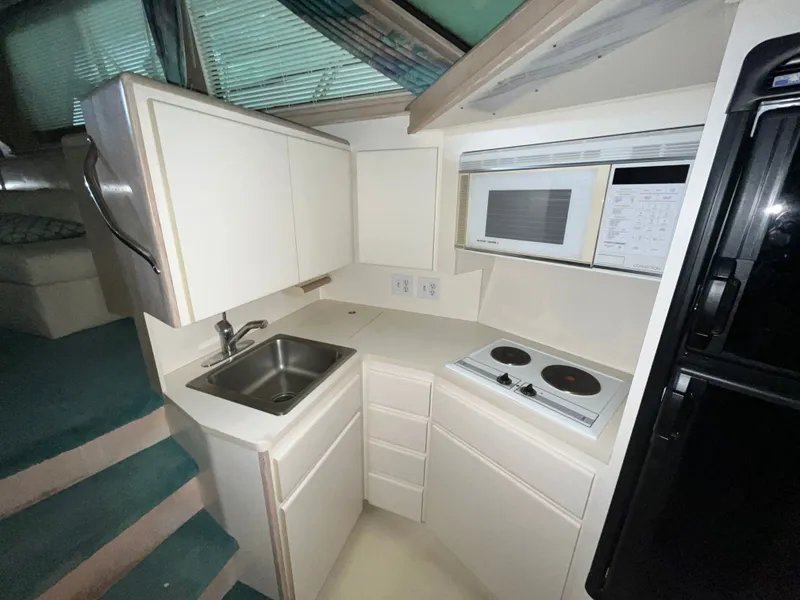 Slide: The Image of Compact kitchen in a 1991 Hatteras 40 DC yacht. - 12