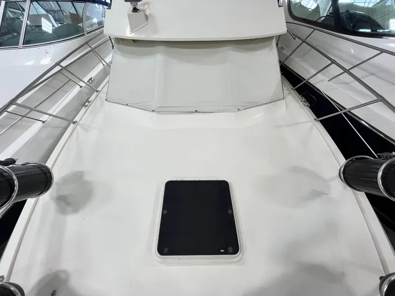 Slide: The Image of Deck of a 1991 Hatteras 40 DC boat with railing. - 17