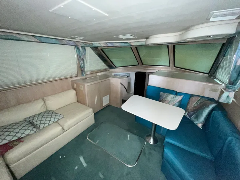 Slide: The Image of Interior of 1991 Hatteras 40 DC yacht with sofa and table. - 9