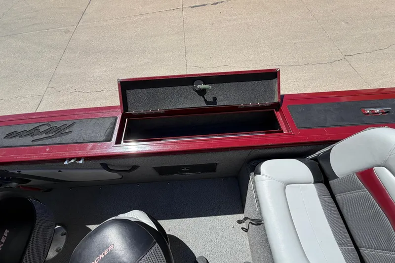 Slide: The Image of 2016 Tracker Targa 18 WT boat with open storage compartment. - 8