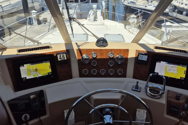 Slide: The Image of Pilothouse of 2008 Meridian 490 yacht with navigation screens and steering wheel. - 10