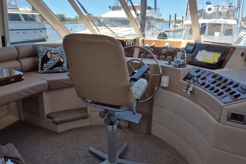 Slide: The Image of Pilothouse interior of 2008 Meridian 490, featuring helm controls and navigation equipment. - 11