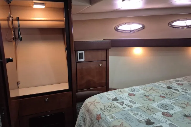 Slide: The Image of Luxurious cabin interior of 2008 Meridian 490 Pilothouse yacht with cozy lighting. - 14