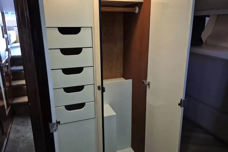 Slide: The Image of Interior of 2008 Meridian 490 Pilothouse showing storage drawers and closet space. - 15