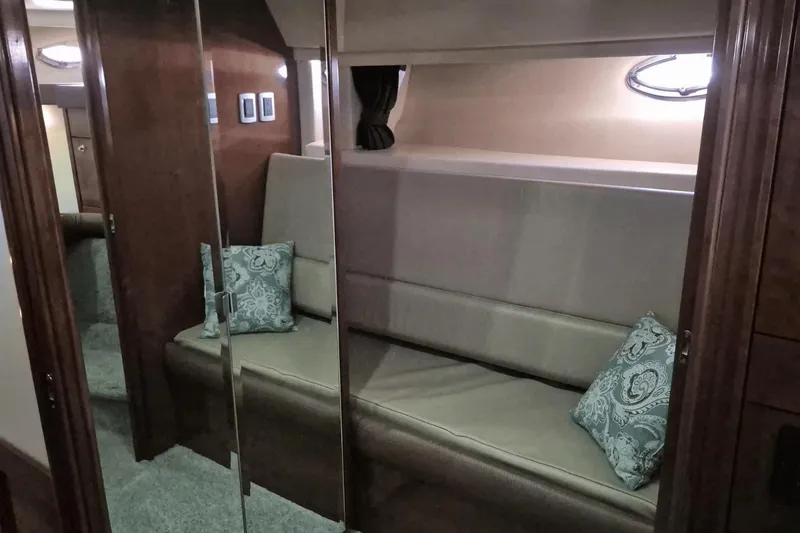 Slide: The Image of Interior of 2008 Meridian 490 Pilothouse with cushioned seating and decorative pillows. - 16