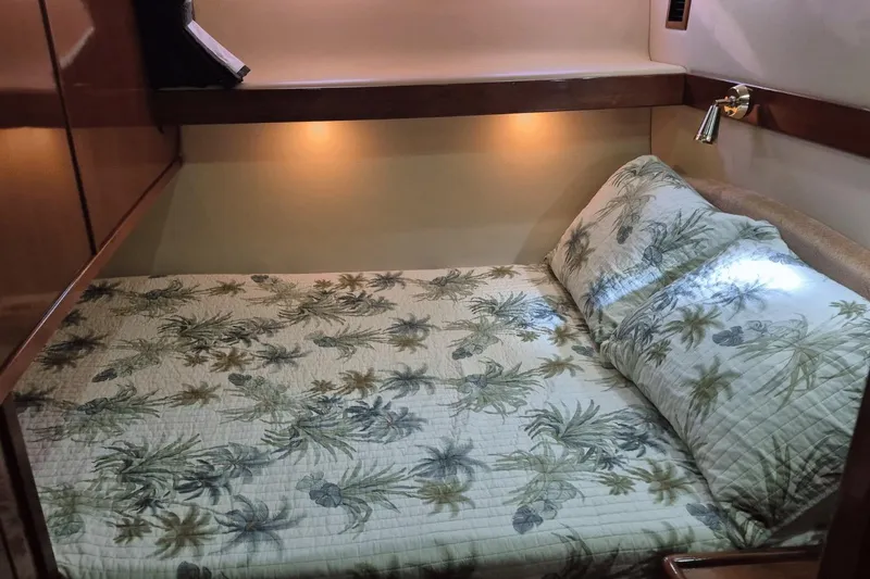 Slide: The Image of Cozy cabin bed in 2008 Meridian 490 Pilothouse yacht with floral bedding. - 19