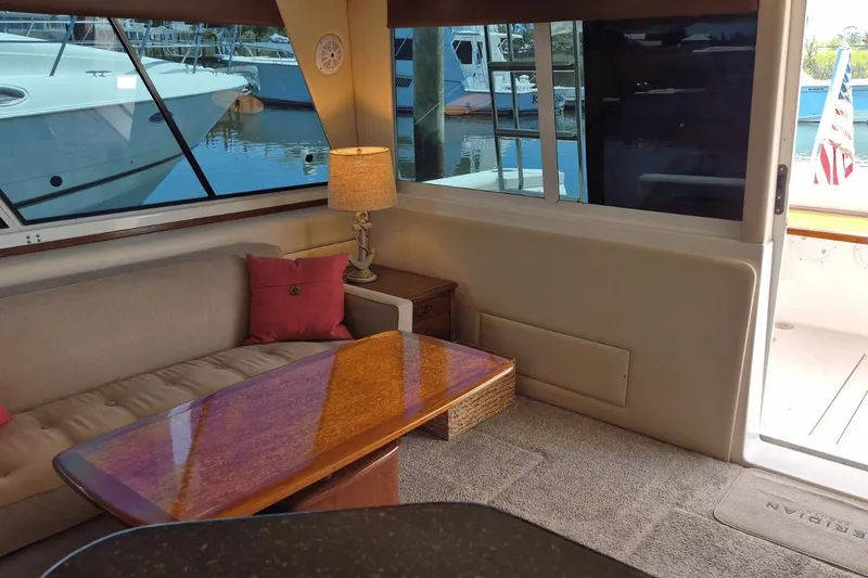 Slide: The Image of Interior of 2008 Meridian 490 Pilothouse yacht with cozy seating and elegant table. - 23
