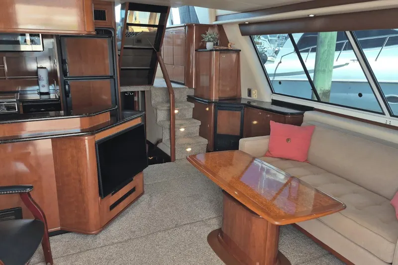 Slide: The Image of Luxurious interior of a 2008 Meridian 490 Pilothouse yacht with elegant wood finishes. - 25