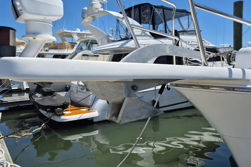 Slide: The Image of 2008 Meridian 490 Pilothouse yacht docked, featuring anchor and radar equipment. - 3