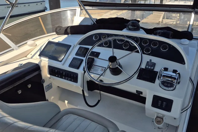 Slide: The Image of Pilothouse of 2008 Meridian 490 yacht with steering wheel and navigation controls. - 6