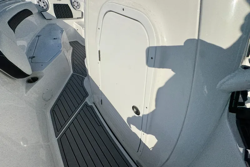 Slide: The Image of 2026 Tidewater 232 SS boat interior with sleek design and modern features. - 11