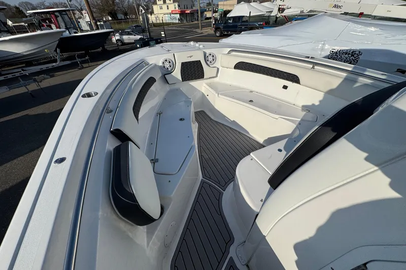 Slide: The Image of 2026 Tidewater 232 SS boat interior with sleek seating and modern design. - 12
