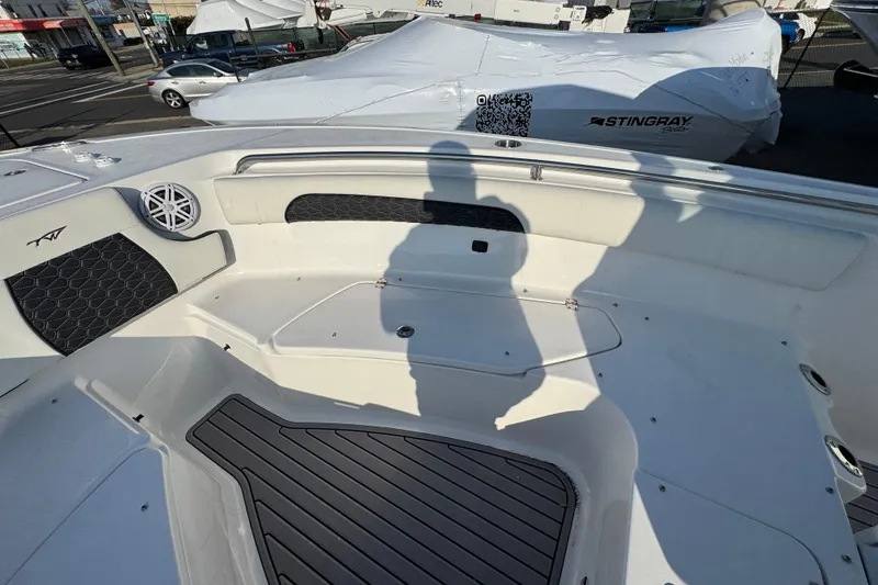 Slide: The Image of 2026 Tidewater 232 SS boat interior with seating and speaker, showcasing modern design. - 13