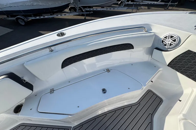 Slide: The Image of 2026 Tidewater 232 SS boat interior with sleek seating and modern speaker system. - 15
