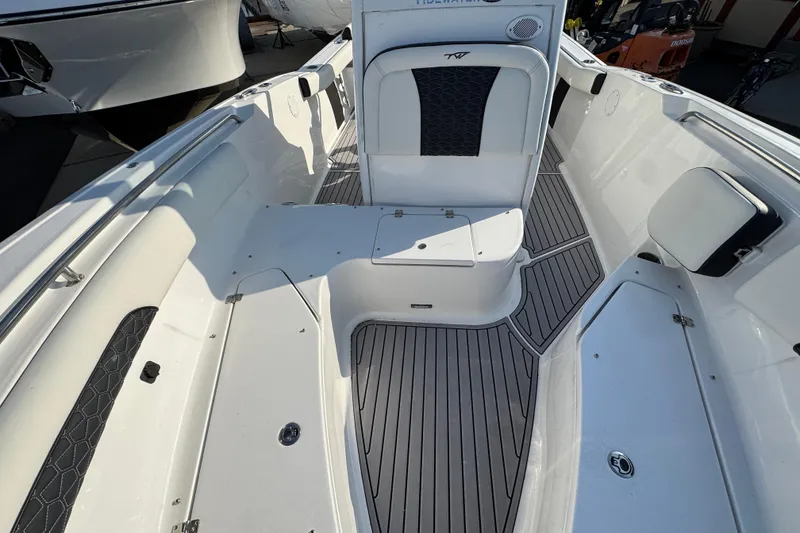 Slide: The Image of 2026 Tidewater 232 SS boat interior with sleek seating and modern design. - 18