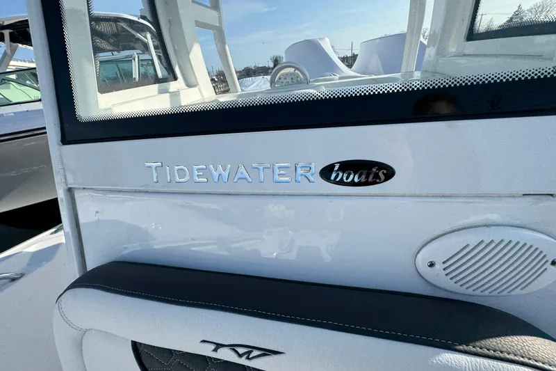Slide: The Image of 2026 Tidewater 232 SS boat logo and branding detail on white surface. - 20