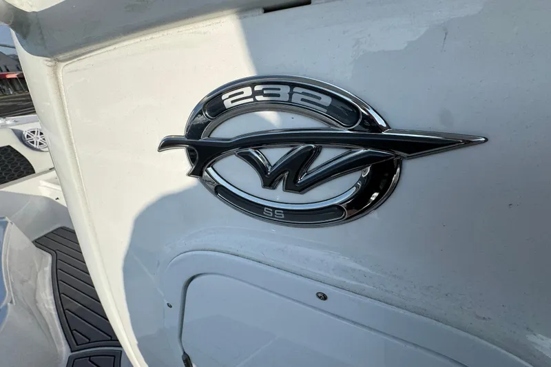 Slide: The Image of 2026 Tidewater 232 SS boat emblem on white surface, showcasing sleek design. - 21