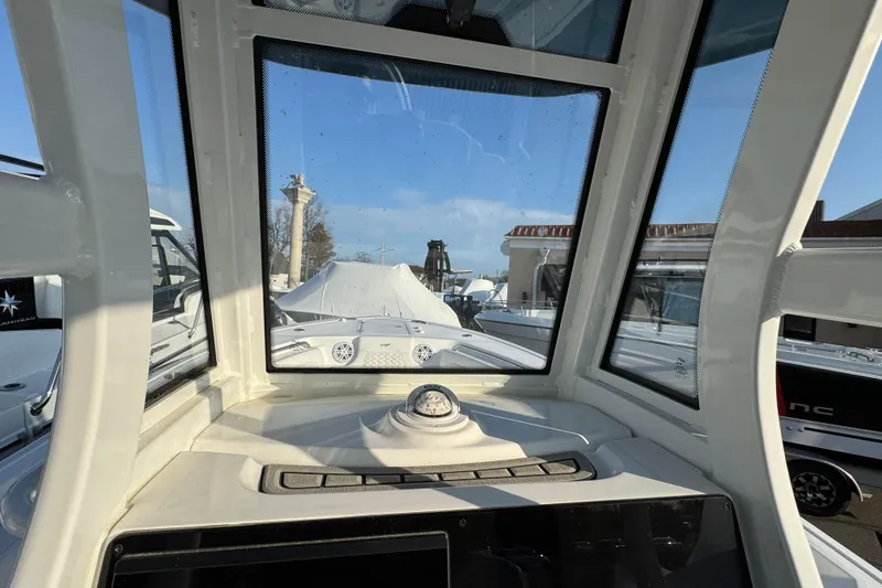 Slide: The Image of Interior view of 2026 Tidewater 232 LXF boat cockpit with clear windshield. - 15