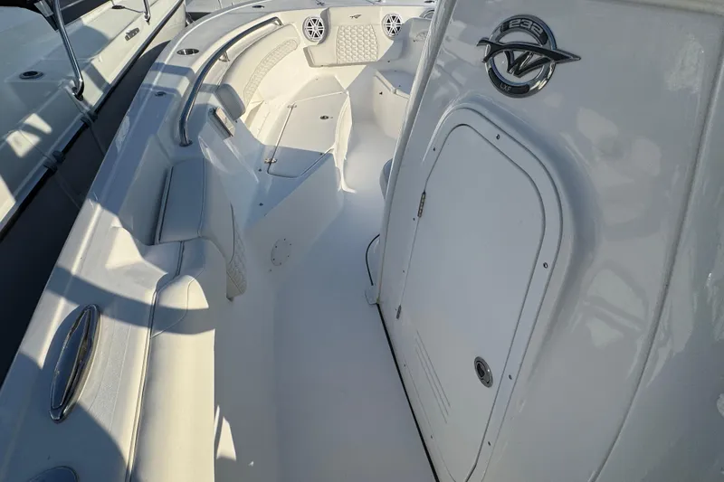Slide: The Image of 2026 Tidewater 232 LXF boat interior with seating and storage compartment. - 17
