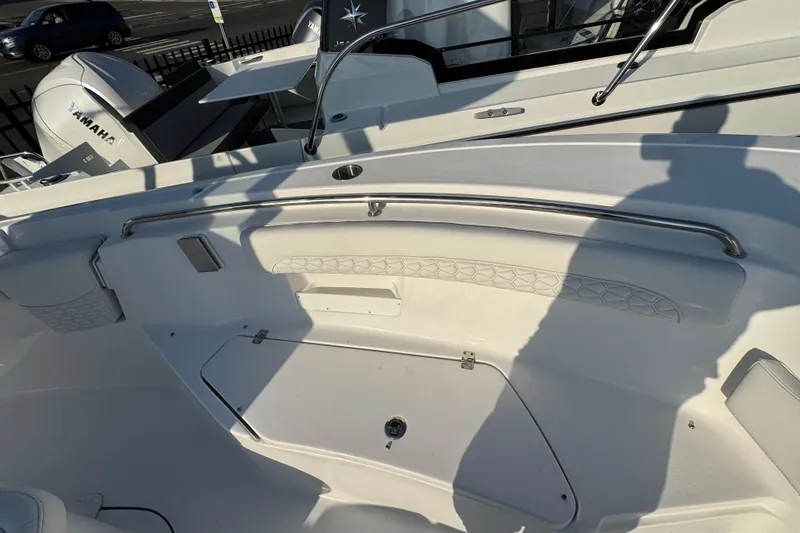 Slide: The Image of 2026 Tidewater 232 LXF boat interior with Yamaha engine, featuring sleek design and storage compartment. - 20