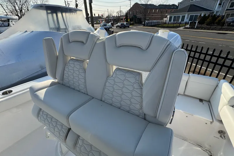 Slide: The Image of 2026 Tidewater 232 LXF boat with luxurious white seating and modern design. - 9