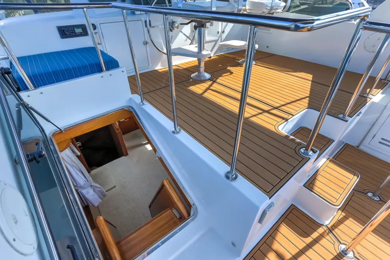 Slide: The Image of 2003 Jefferson Pilothouse 57 yacht deck with wood flooring and stainless steel railings. - 30