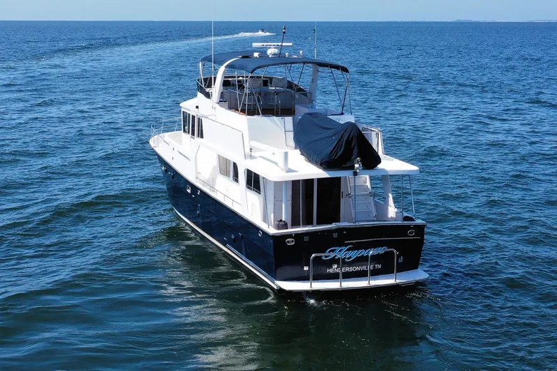 Slide: The Image of 2003 Jefferson Pilothouse 57 yacht cruising on open water. - 4