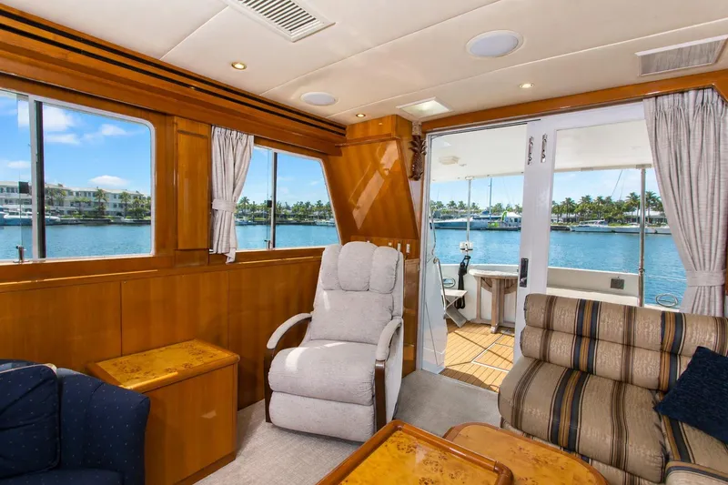Slide: The Image of Luxurious interior of 2003 Jefferson Pilothouse 57 yacht with waterfront view. - 40