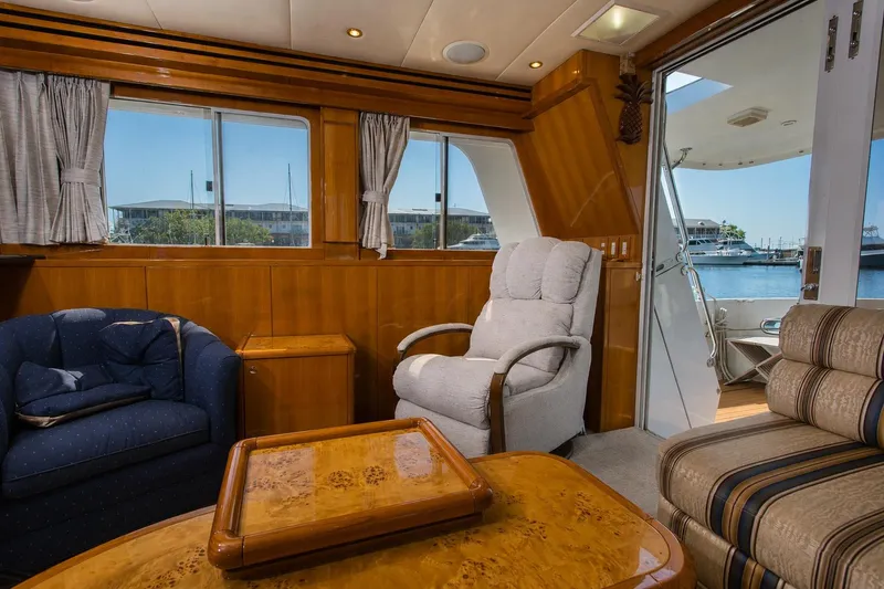 Slide: The Image of Luxurious interior of 2003 Jefferson Pilothouse 57 yacht with comfortable seating and waterfront view. - 43