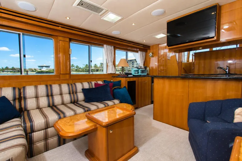Slide: The Image of Luxurious interior of 2003 Jefferson Pilothouse 57 yacht with elegant wood finishes and comfortable seating. - 44