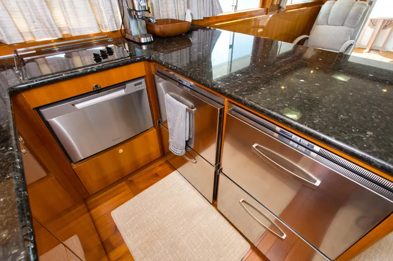 Slide: The Image of Luxurious kitchen area in a 2003 Jefferson Pilothouse 57 yacht with stainless steel appliances. - 49