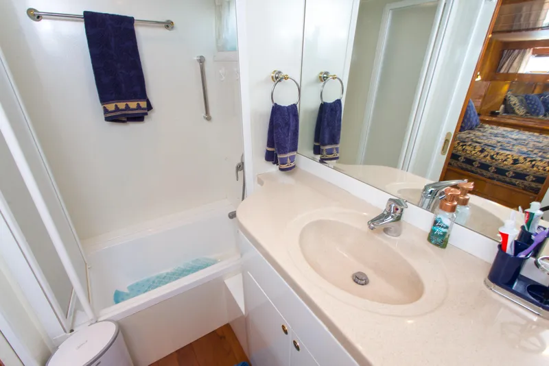 Slide: The Image of Luxurious bathroom in 2003 Jefferson Pilothouse 57 yacht with elegant decor and amenities. - 76