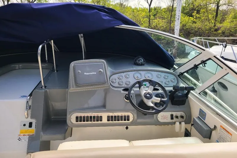Slide: The Image of 2006 Cruisers Yachts 3470 Express helm with steering wheel and instrument panel. - 10