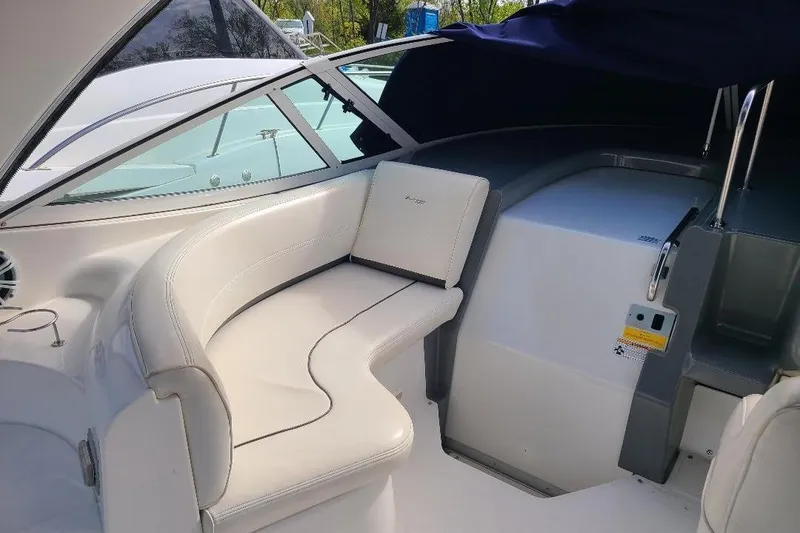 Slide: The Image of 2006 Cruisers Yachts 3470 Express interior with white seating and modern design. - 11