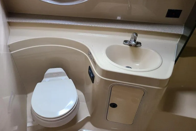 Slide: The Image of Bathroom interior of 2006 Cruisers Yachts 3470 Express with toilet and sink. - 2