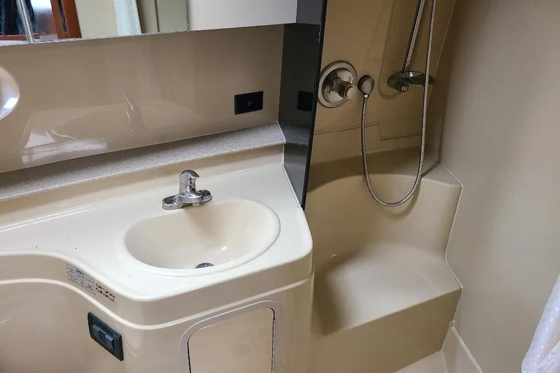 Slide: The Image of 2006 Cruisers Yachts 3470 Express bathroom with sink and shower area. - 20