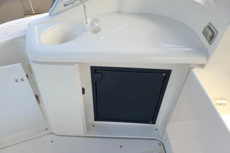 Slide: The Image of 2006 Cruisers Yachts 3470 Express boat sink and storage area. - 5