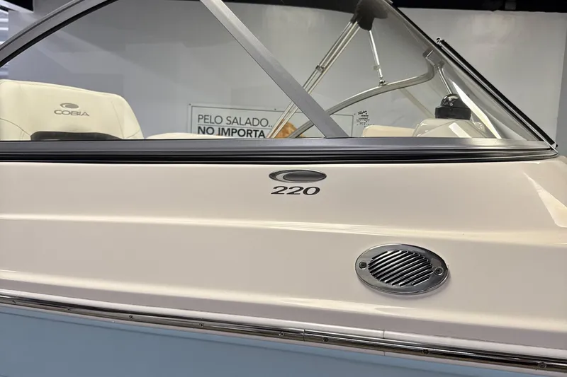 Slide: The Image of 2024 Cobia 220 Dual Console boat, close-up of design. - 4