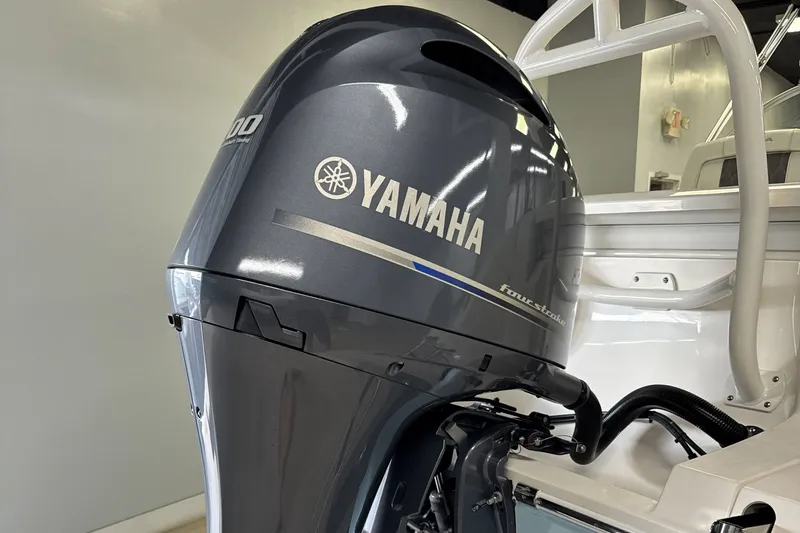 Slide: The Image of Yamaha outboard motor on 2024 Cobia 220 Dual Console boat. - 9