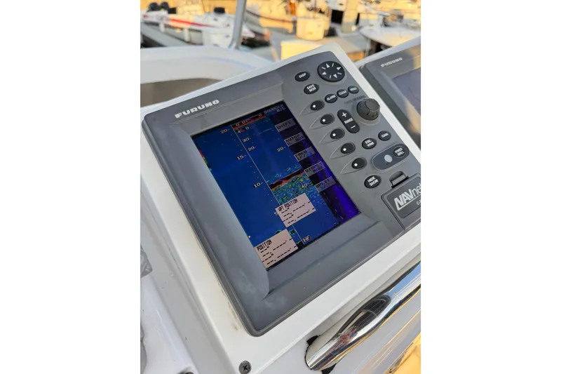 Slide: The Image of Furuno navigation system on 1998 Luhrs Tournament 320 Convertible boat dashboard. - 12