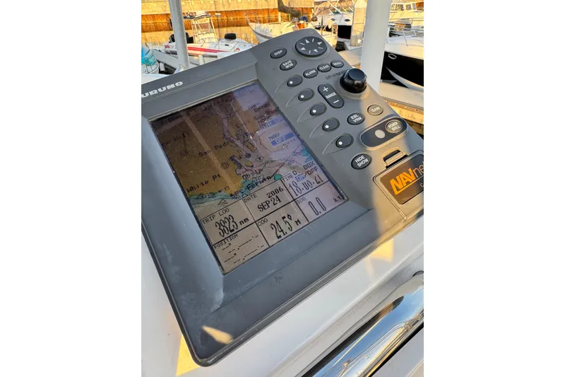 Slide: The Image of Navigation system on a 1998 Luhrs Tournament 320 Convertible boat, displaying a nautical map. - 13