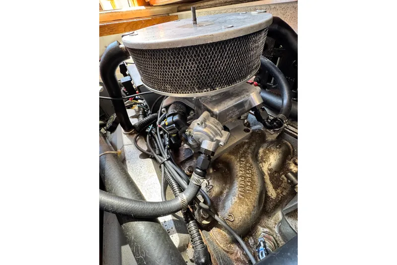 Slide: The Image of Engine of 1998 Luhrs Tournament 320 Convertible boat, showcasing intricate mechanical components. - 27